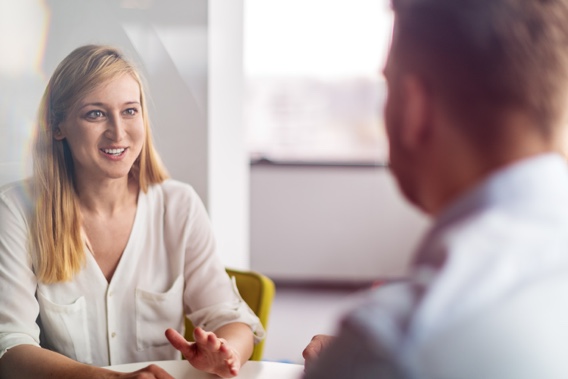 Two people discussing software development solutions