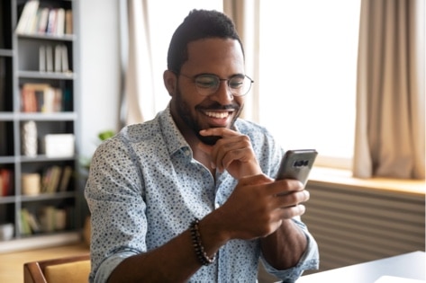 A man using an insurance mobile app with personalised solutions