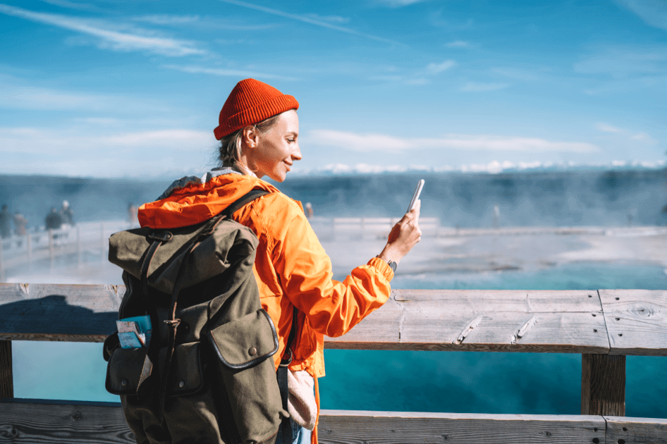 Woman using a mobile travel app during a trip