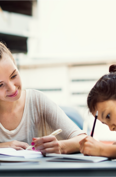 Woman teaching a child