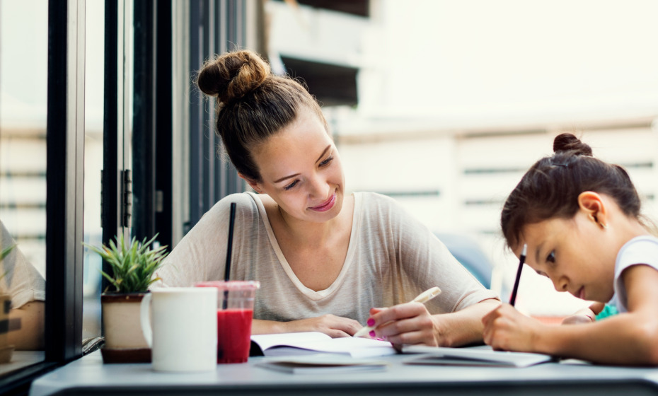 Woman teaching a child